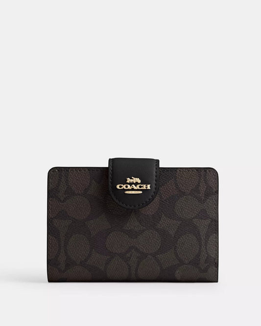 Cartera Coach médium corner zip wallet in signature canvas
