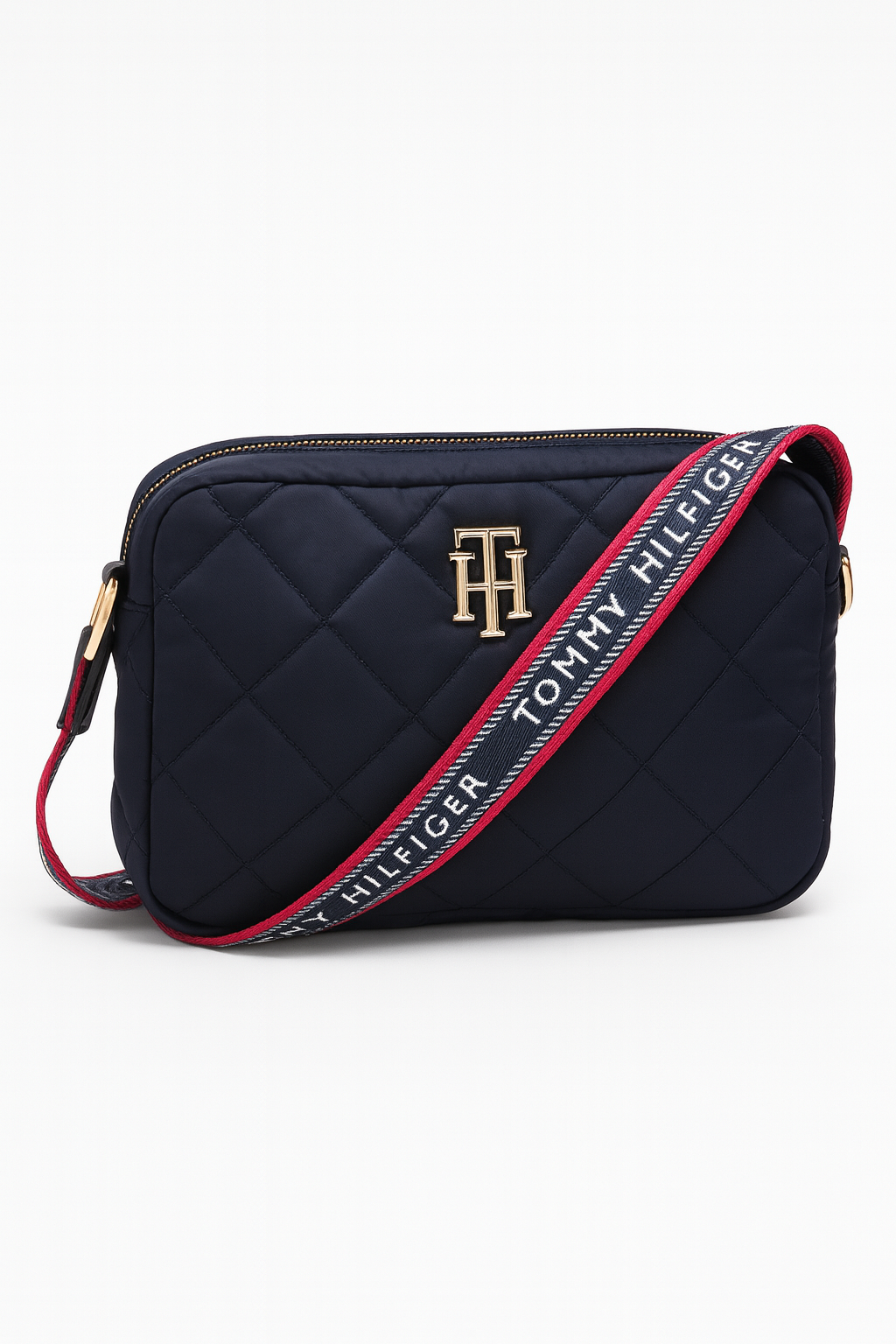 Crossbody Tommy H azul marino capitonada con placa TH dorada