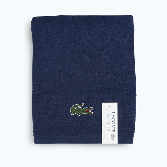 Toalla Lacoste toda en azul marino con logo en verde