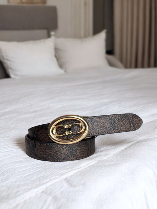 Cinturón Coach chocolate/canvas, negro liso placa dorada, reversible