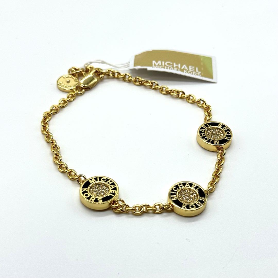 Pulsera Michael K dorada con negro