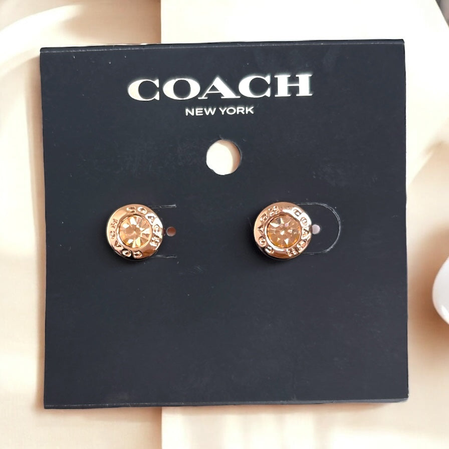 Aretes Coach gold rose grabados