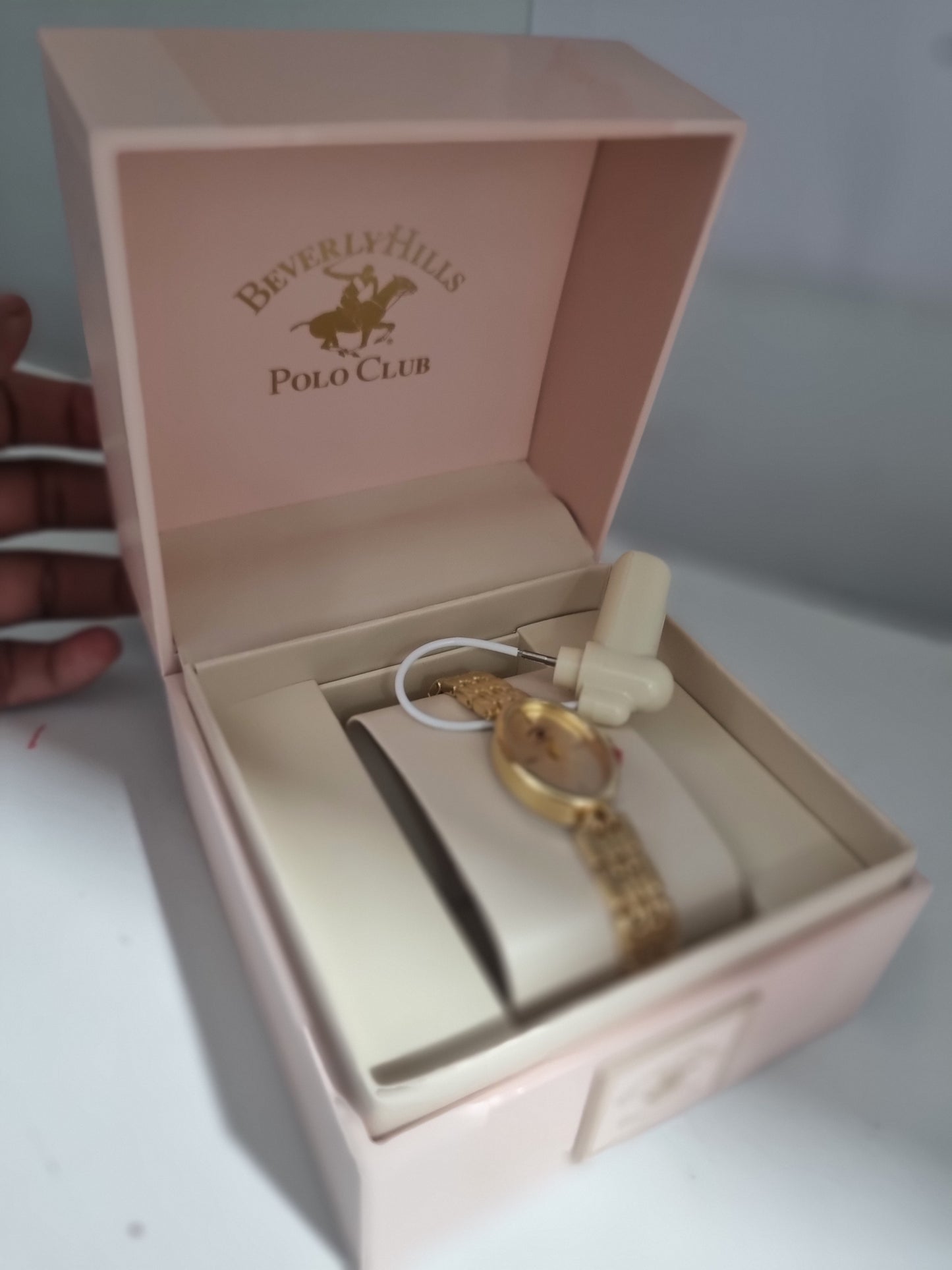 Reloj dorado polo