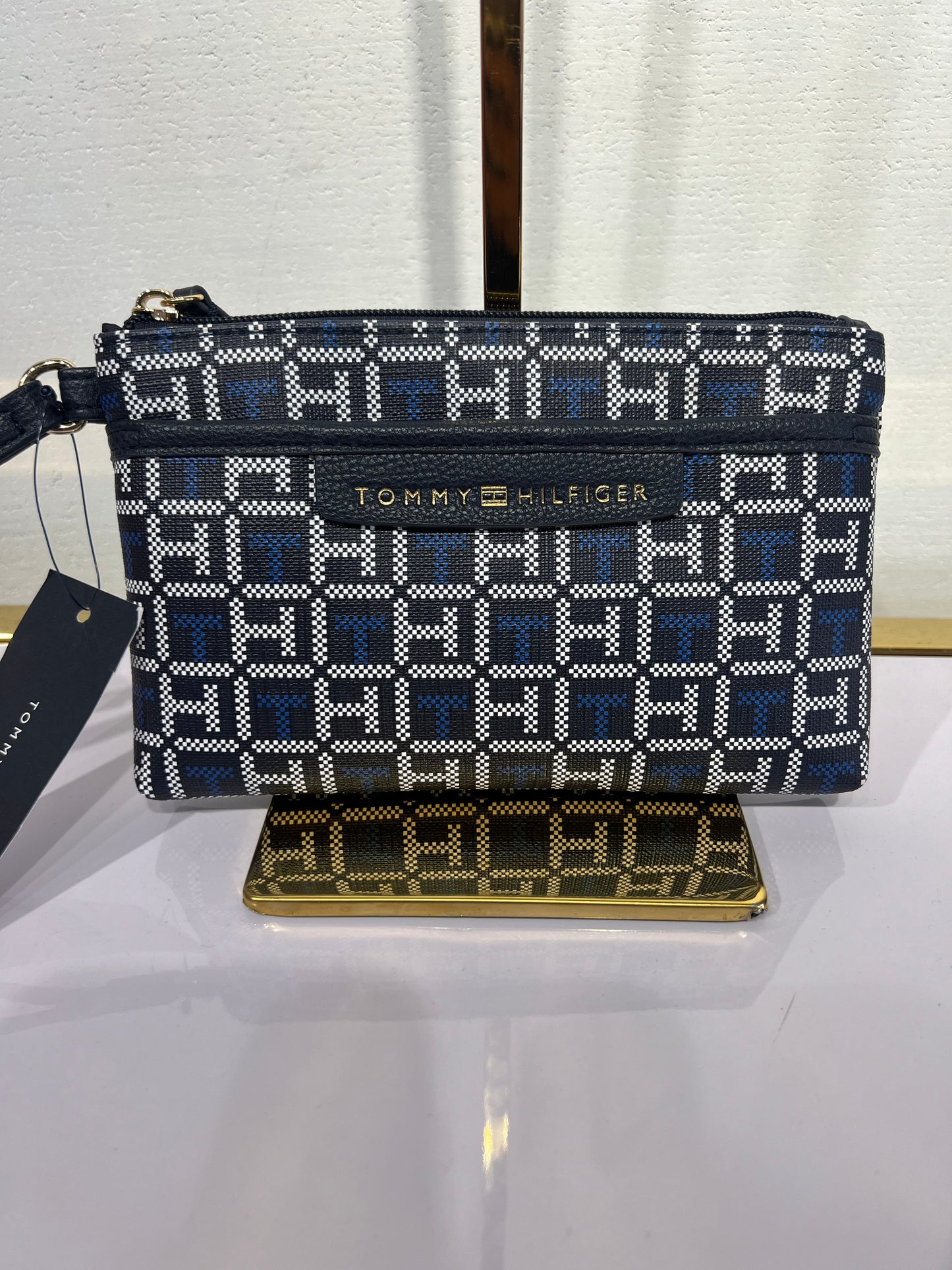 Muñequera Tommy H azul marinl con monogram azul y blanco
