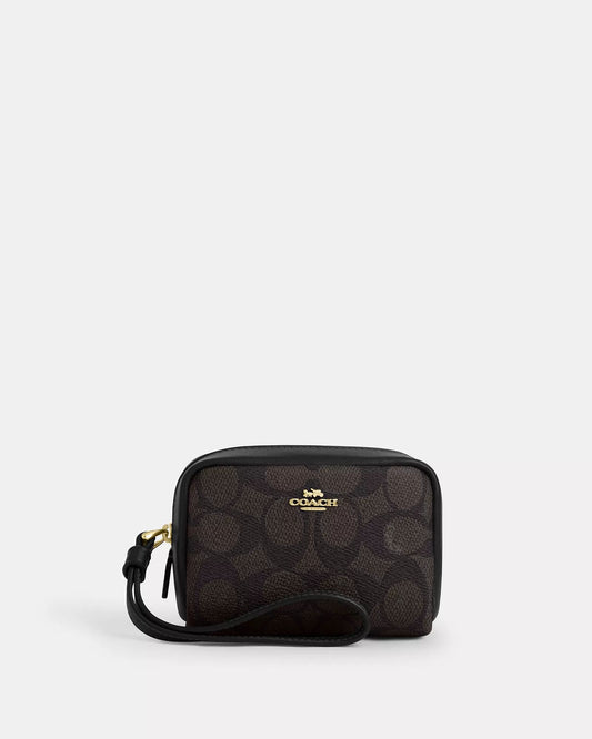 Monedero Coach chocolate/negro con canvas, strap y placa dorada