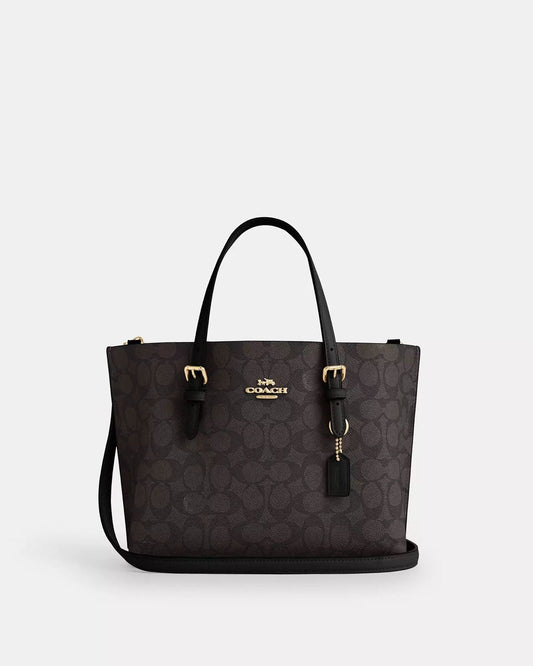 Mini Tote Coach chocolate con canvas en negro, doble strap y placa dorada
