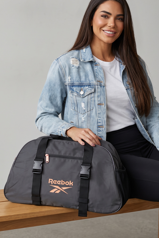 Maleta Reebok negra y rose Gold