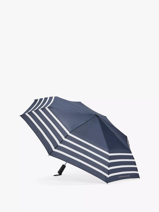 Sombrilla Tommy H azul marino con rayas blancas, mango negro y botones de abrir/cerrar