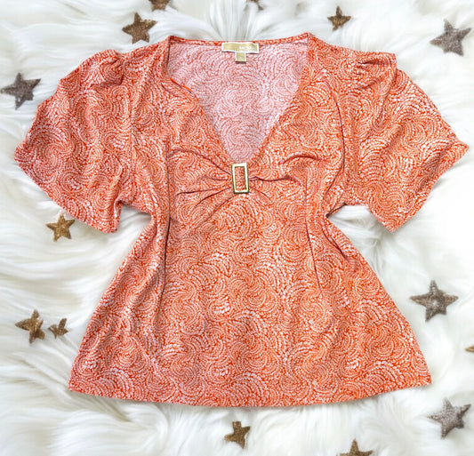 Blusa Michael k naranja con placa dorada