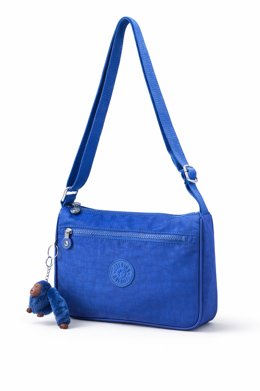 Crossbody Kipling azul rey con changuito y placa de goma