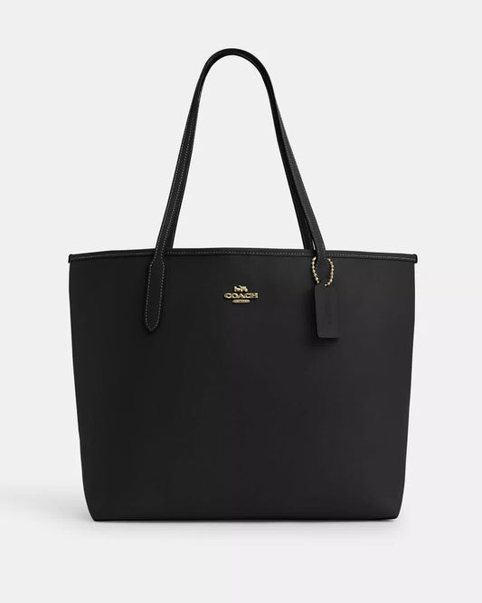Tote Coach negra, grande con placa dorada