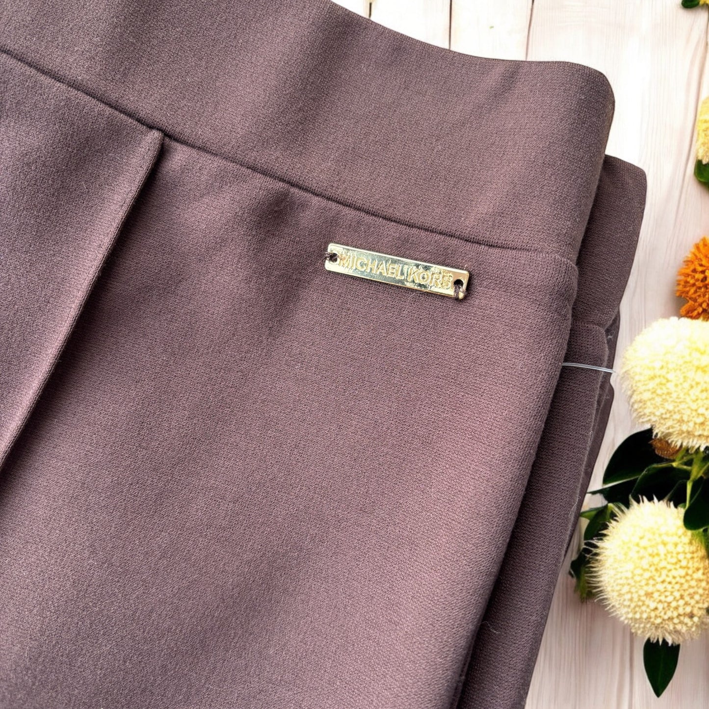 Leggings Michael K chocolate con placa