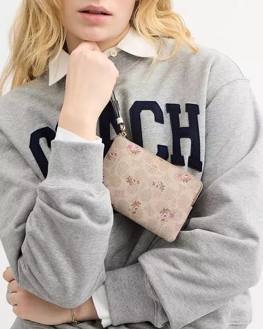 Muñequera Coach baige con monogram floreada y strap crema