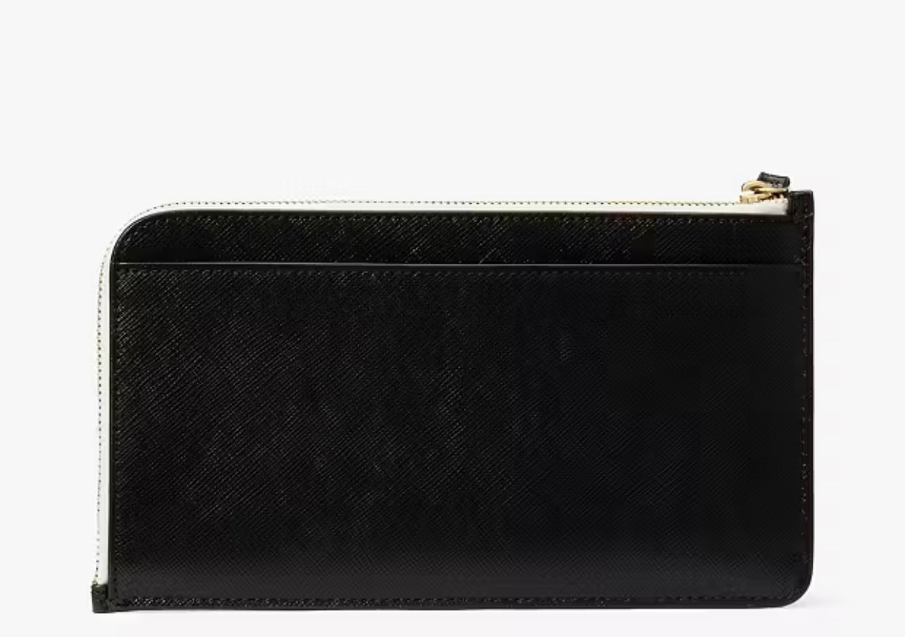 Muñequera Kate Spade Lucy, negra con letras blancas