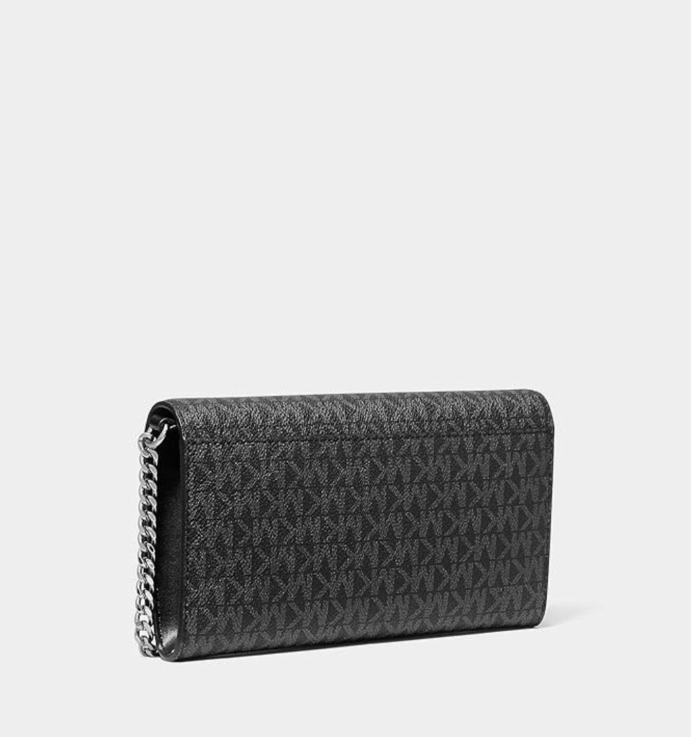 Crossbody Michael K negra con monogram