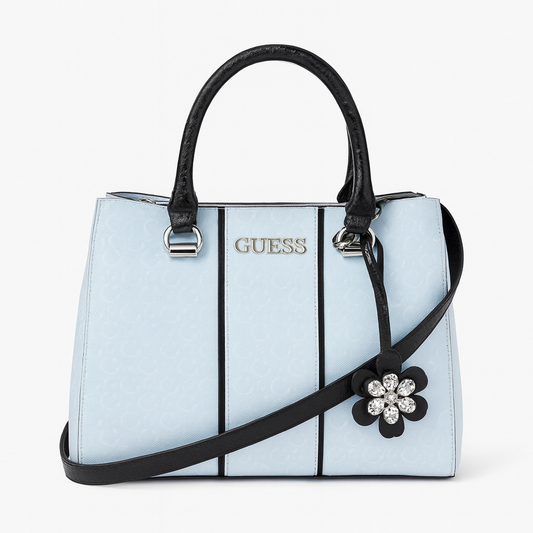 Tote Guess blanca/negro tipo charol con llavero de flor