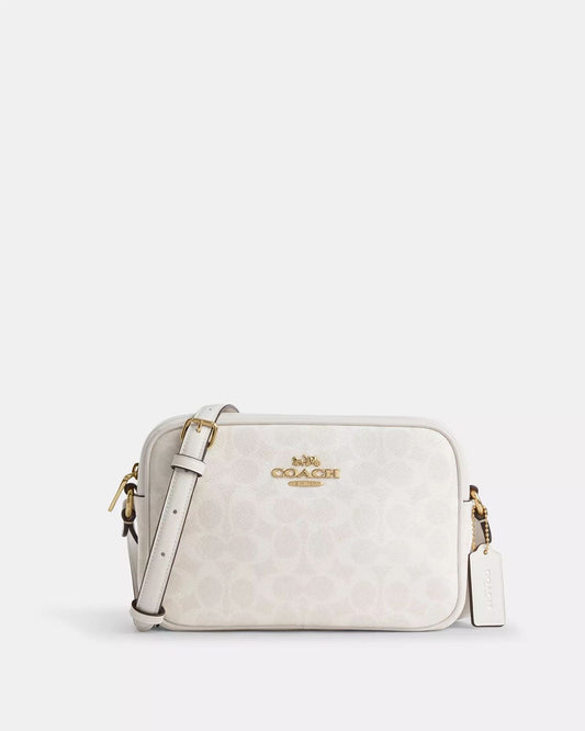 Crossbody Coach Chalk crema con canvas blancas y placa plateada