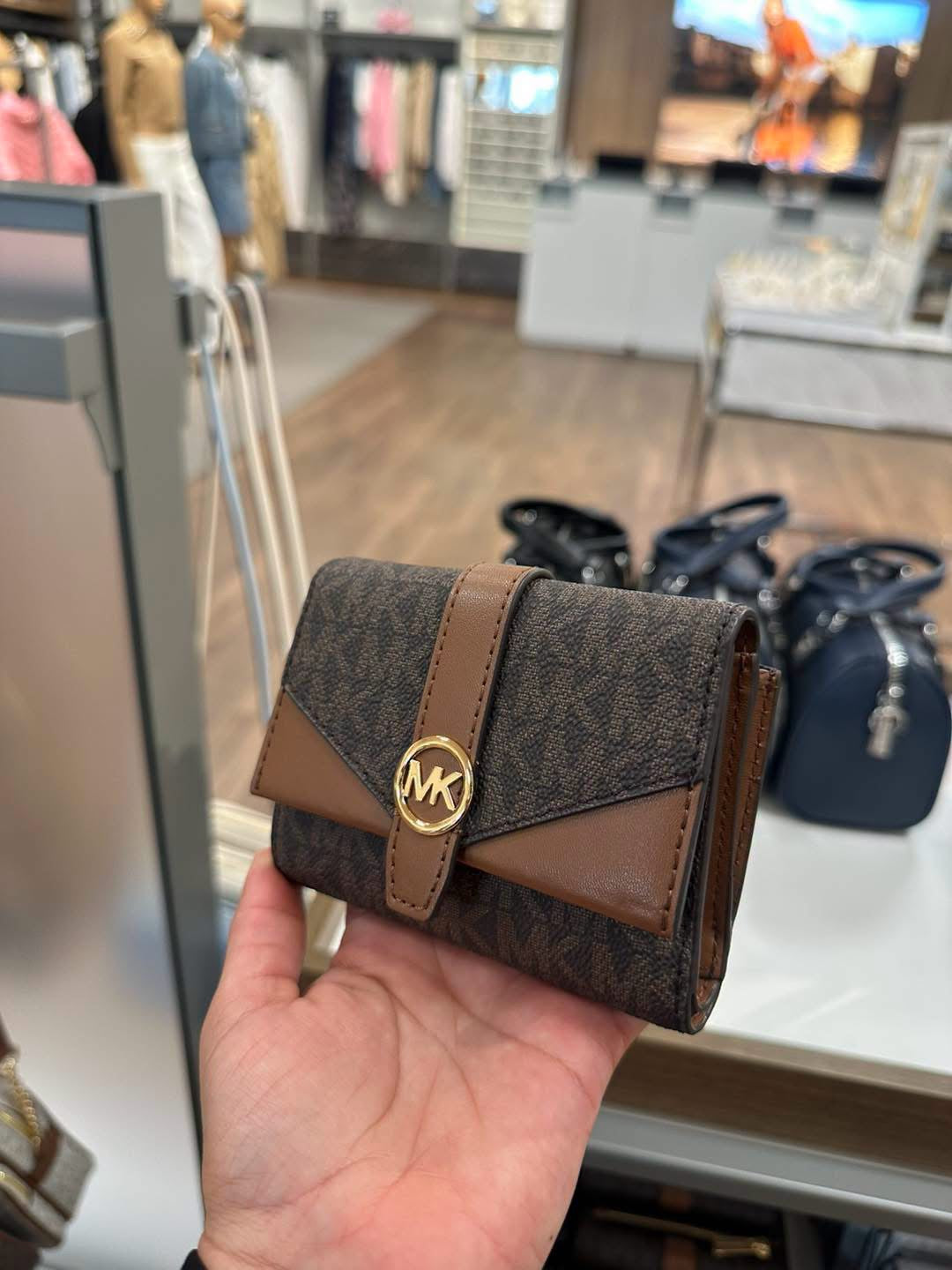 Cartera Michael k Brown logo