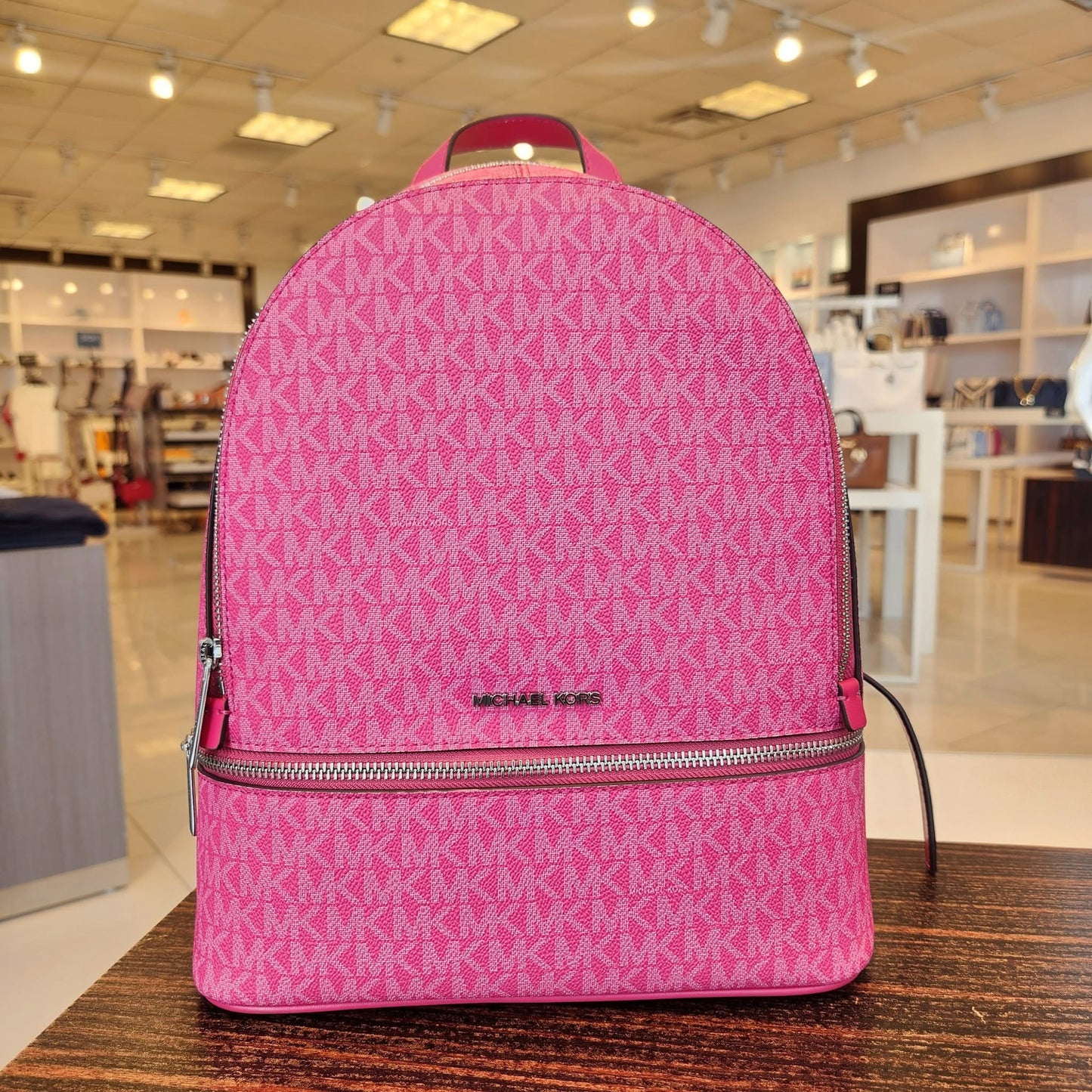 Backpack Michael K fucsia con herrajes plateados