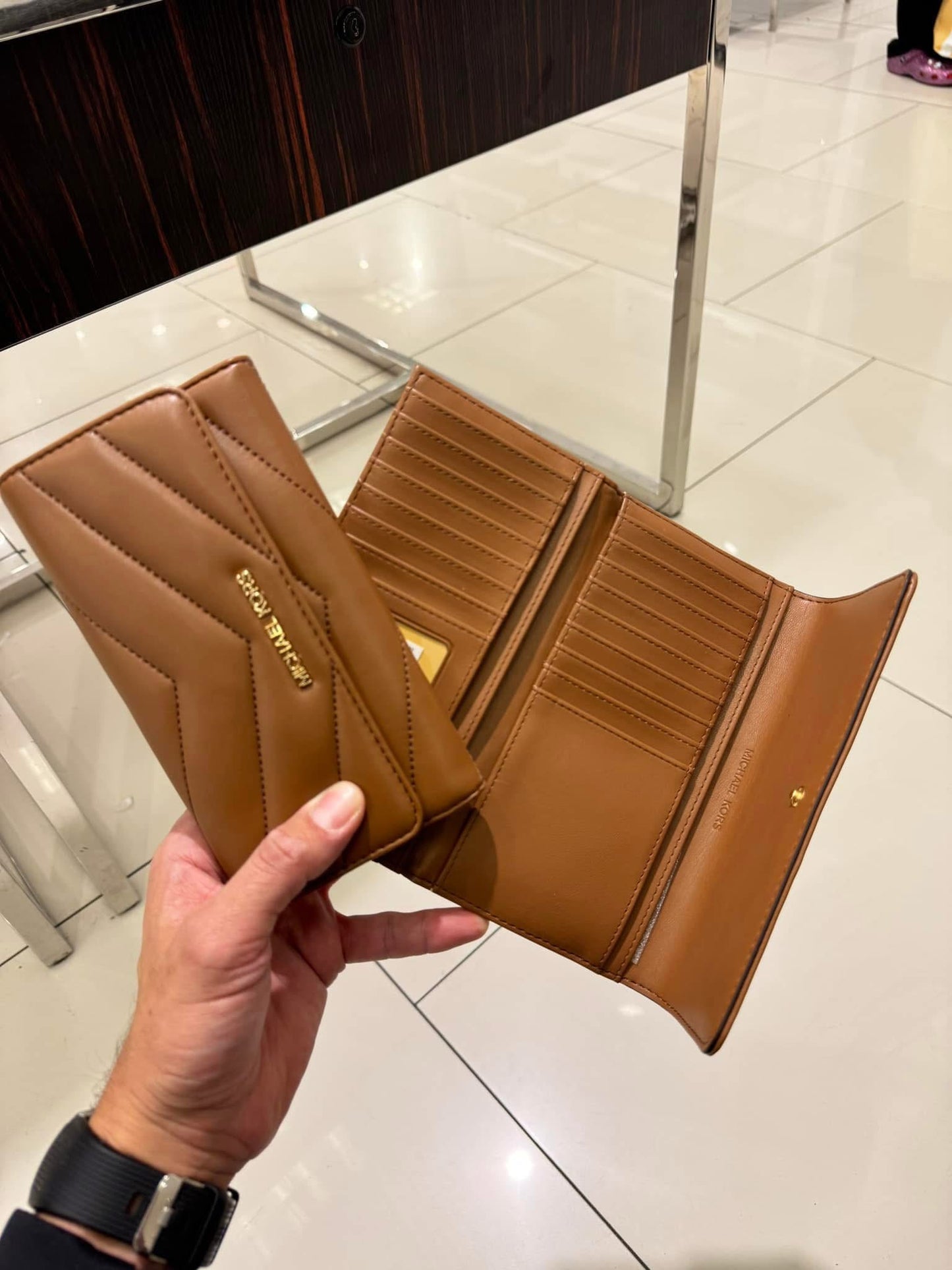 Cartera Michael K café acolchonada