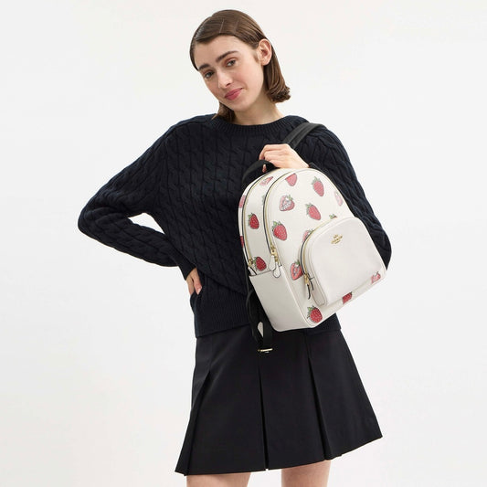 Backpack Coach beige con fresas, strap negro y placa dorada