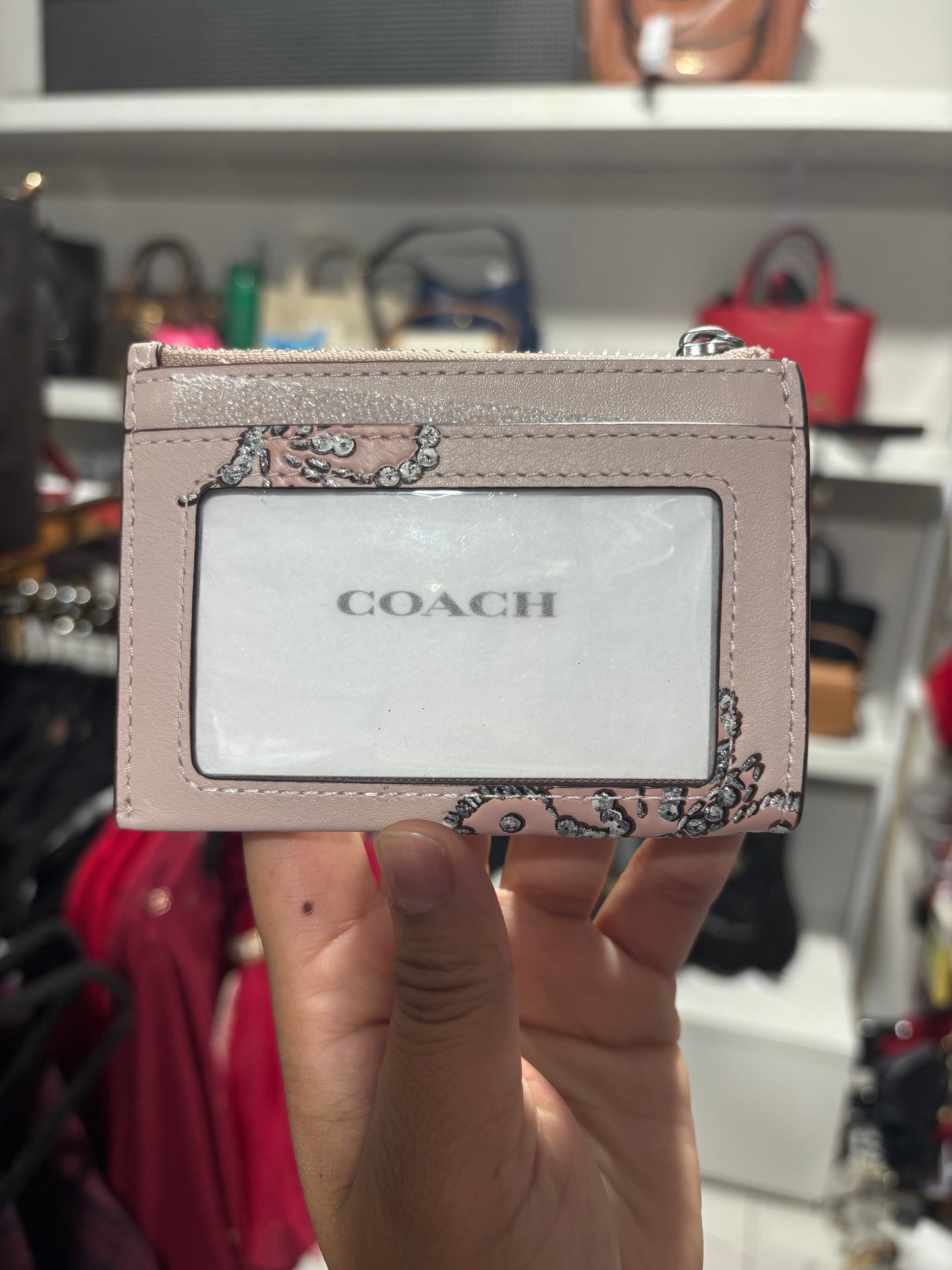 Tarjetero Coach rosa de mariposa