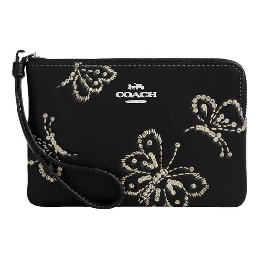 Muñequera Coach negra de mariposas