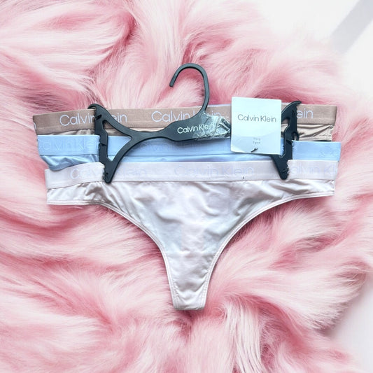 Tangas Calvin K 3 pz colores camel,azul claro y rosa bebé