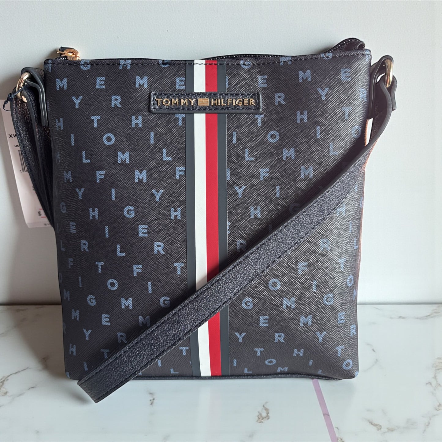 Crossbody Tommy H azul con monogram de letras