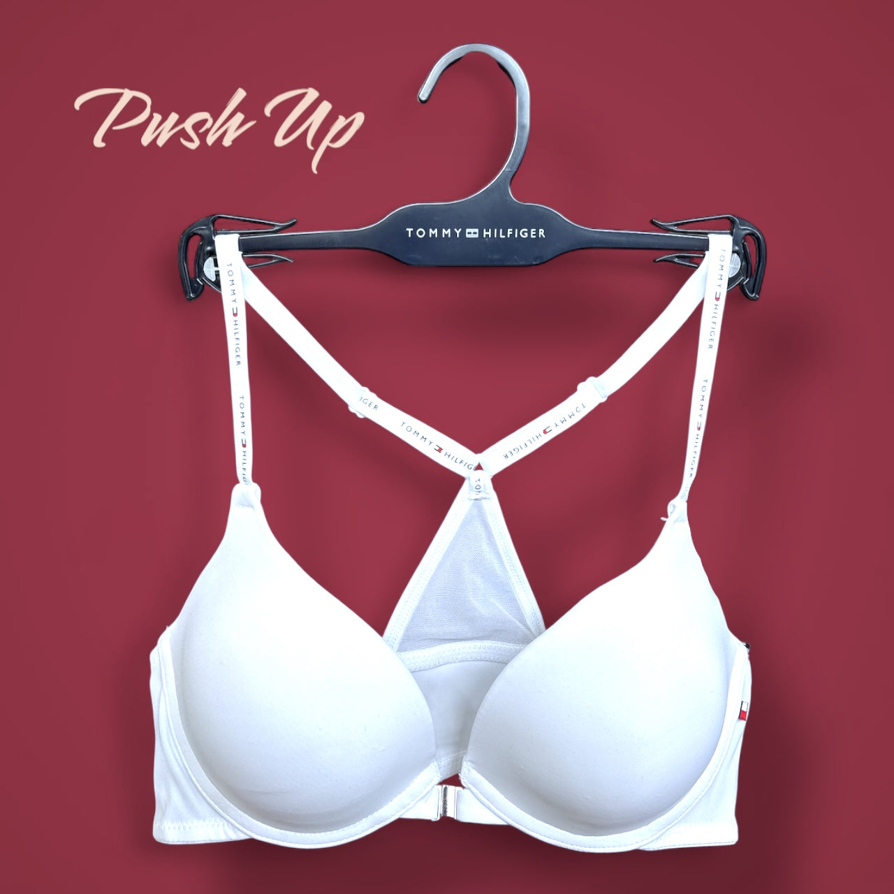 Brasier TommyH blanco, strap cruzado y broche plateado enfrente