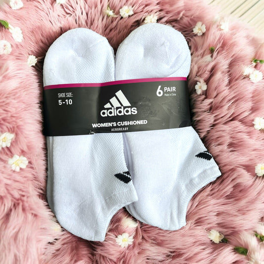 Tines Adidas blancos con logo negro