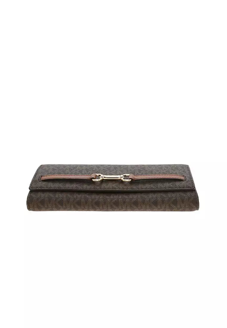 Crossbody Michael k Carson chocolate, monogram, cadena y placa dorada