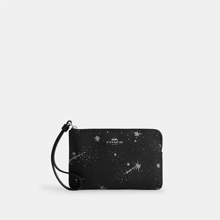 Muñequeta Coach negra conestrellas