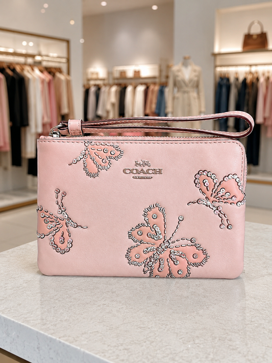 Muñequera Coach de mariposas