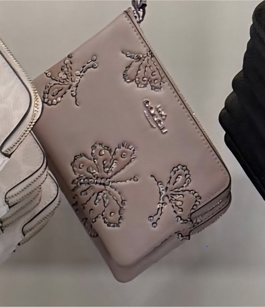Muñequera Coach de mariposas